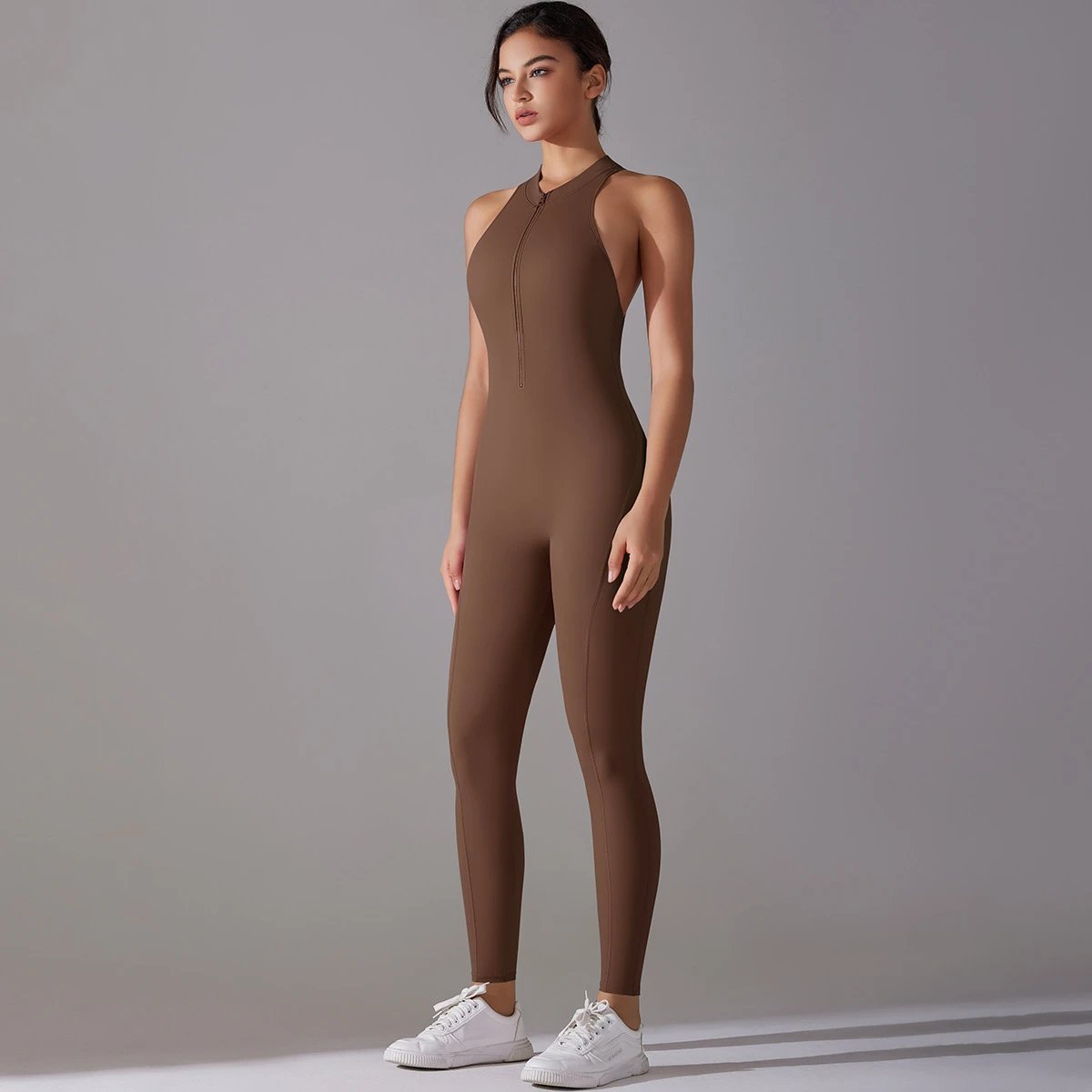 A jumpsuit is a one – piece outfit combining a top and trousers. — O-11809