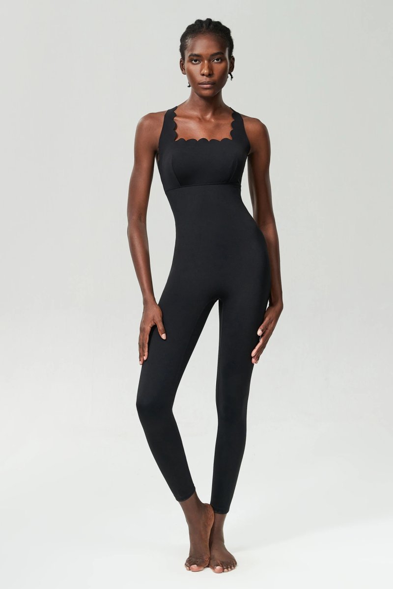 A jumpsuit is a one – piece outfit combining a top and trousers — O-11825