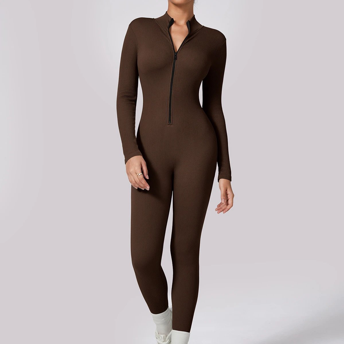 A jumpsuit is a one – piece outfit combining a top and trousers. — O-11853.1