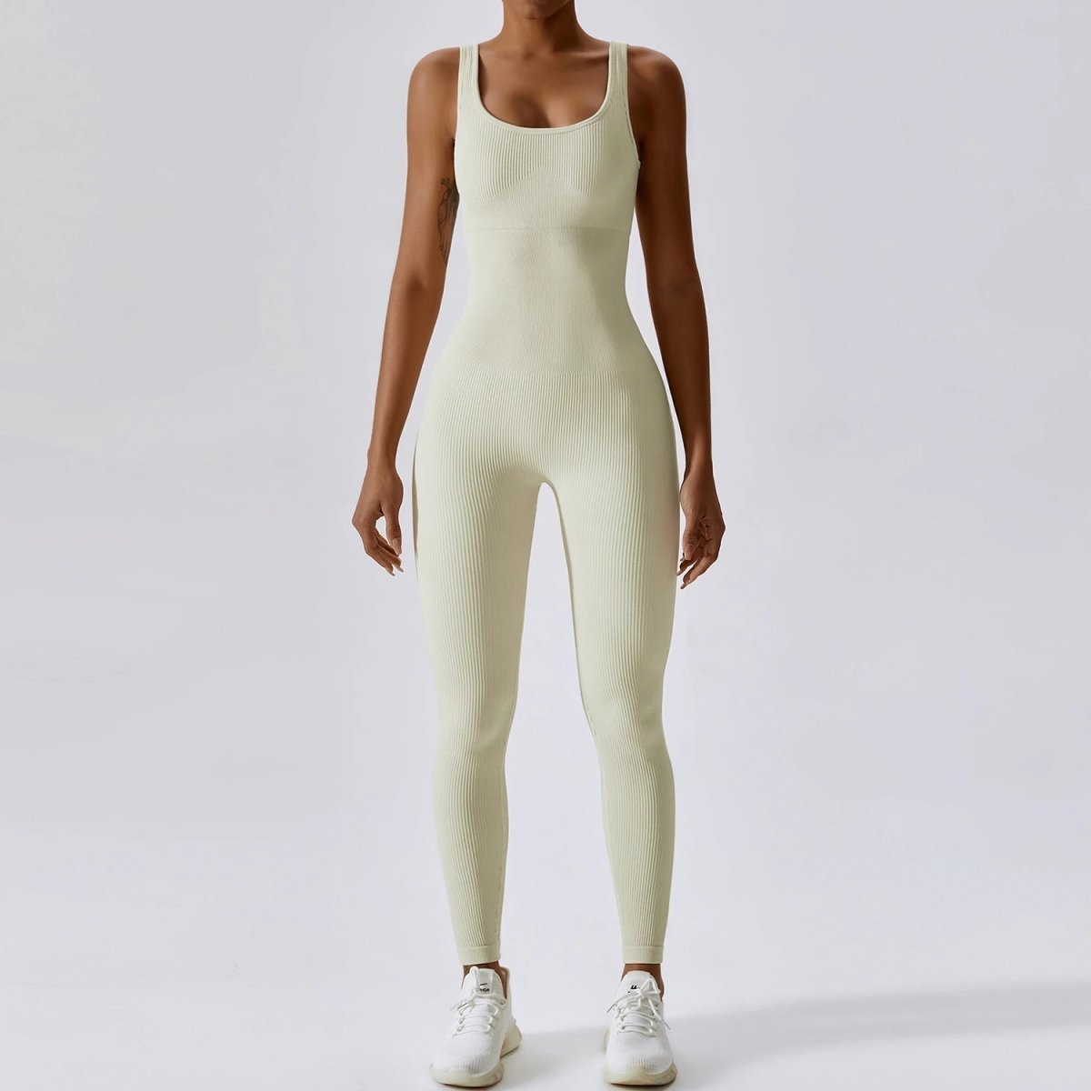 A jumpsuit is a one – piece outfit combining a top and trousers. — O-11871.1