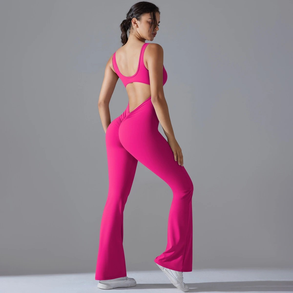 A jumpsuit is a one – piece outfit combining a top and trousers. — O-11888