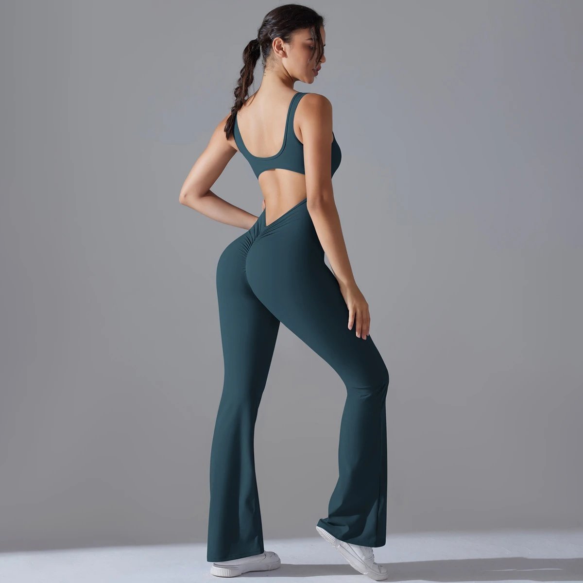 A jumpsuit is a one – piece outfit combining a top and trousers. — O-11889.1