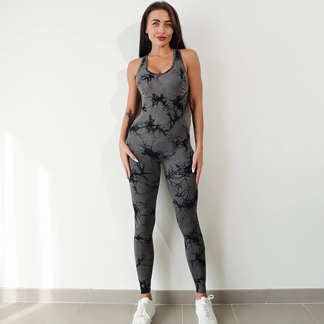 A jumpsuit is a one – piece outfit combining a top and trousers. — O-11900