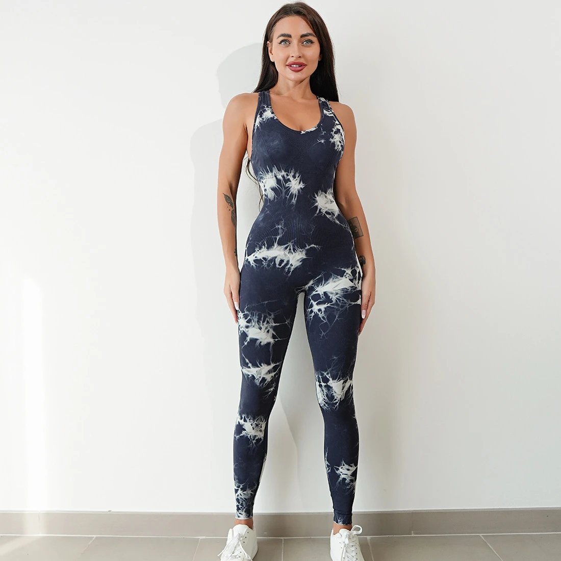 A jumpsuit is a one – piece outfit combining a top and trousers. — O-11901