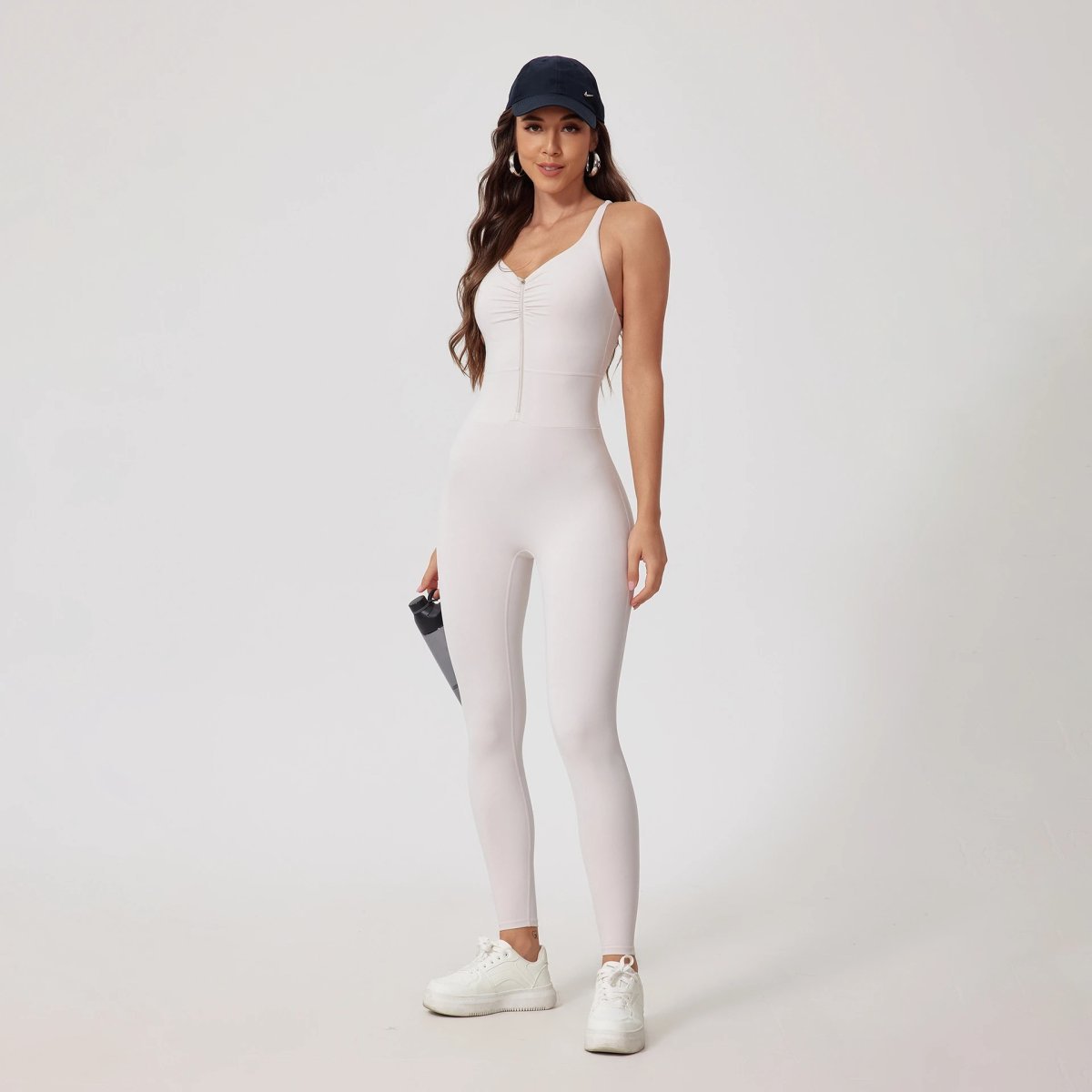 A jumpsuit is a one – piece outfit combining a top and trousers — O-12043