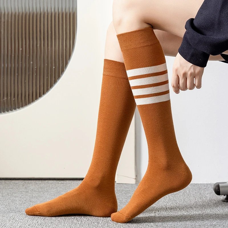 socks are soft coverings worn on the feet to provide comfort. — SOCKS-57049
