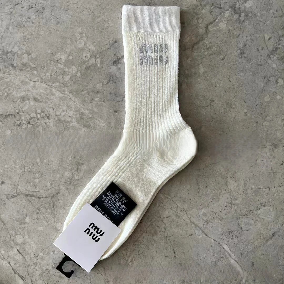socks are soft coverings worn on the feet to provide comfort. — SOCKS-57051
