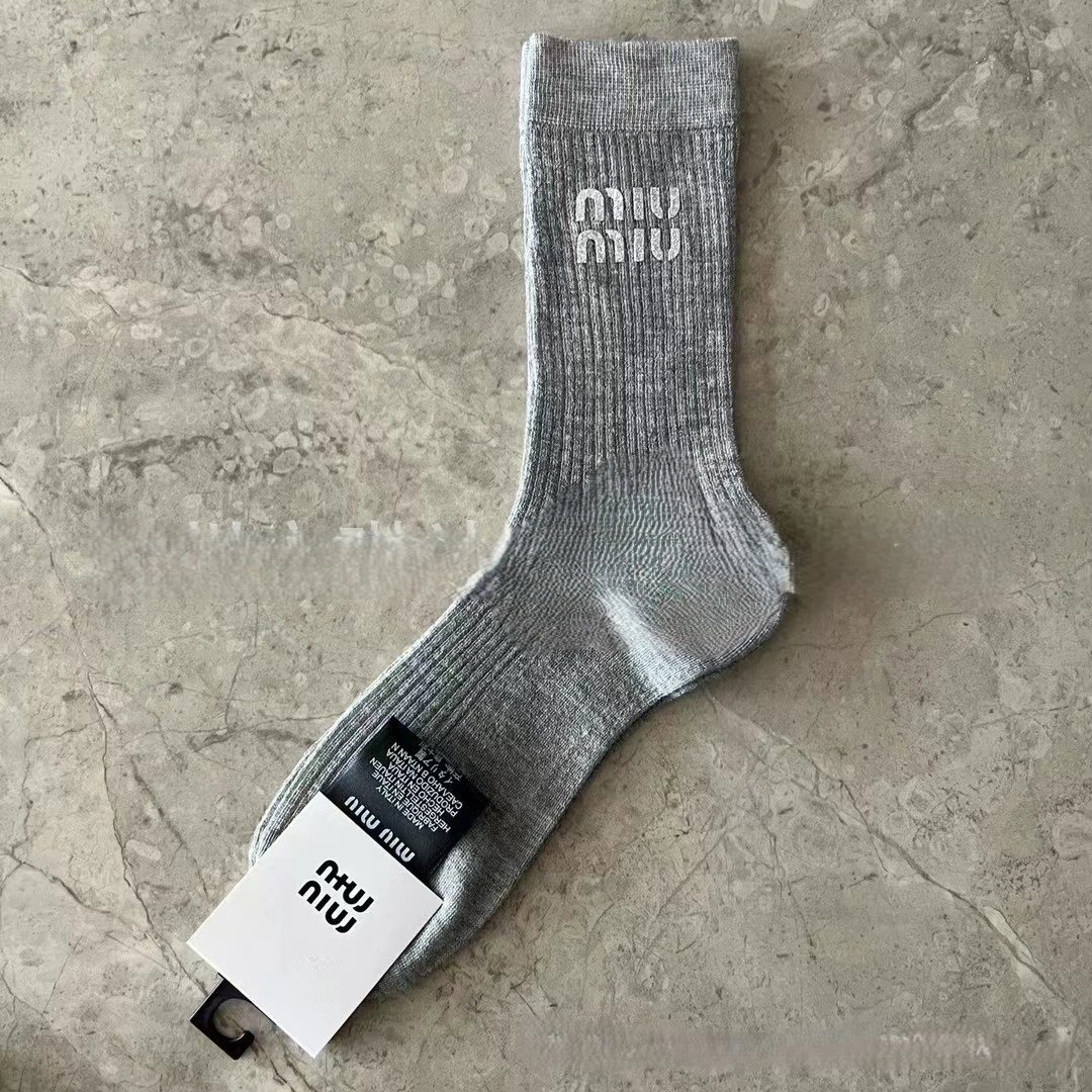 socks are soft coverings worn on the feet to provide comfort. — SOCKS-57054