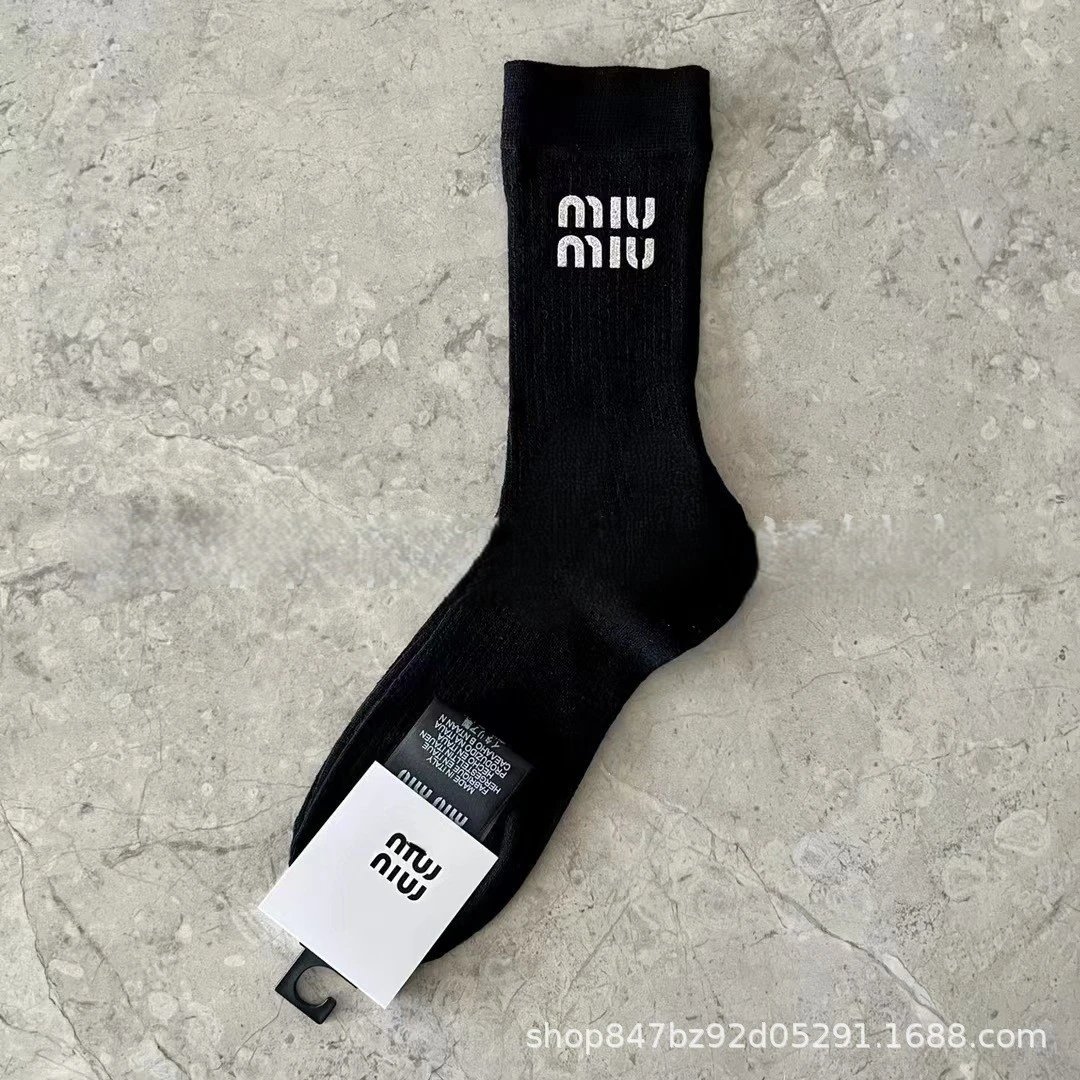 socks are soft coverings worn on the feet to provide comfort. — SOCKS-57055